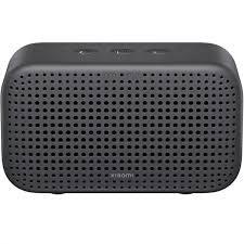 Compact black portable Bluetooth speaker with perforated grille design for wireless audio streaming