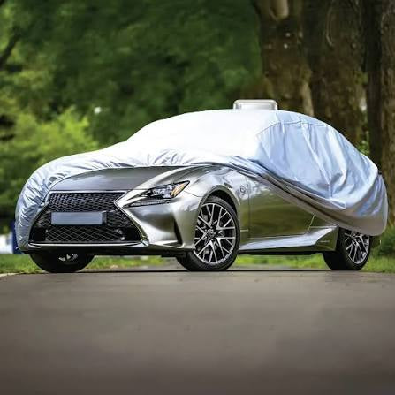Green Lion Solar Auto Car Cover Grey protecting a parked car